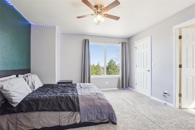 carpeted bedroom with baseboards and a ceiling fan