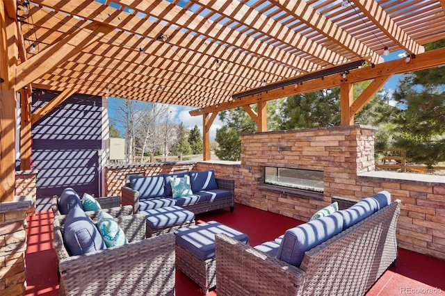 view of patio / terrace featuring an outdoor living space with a fireplace and a pergola