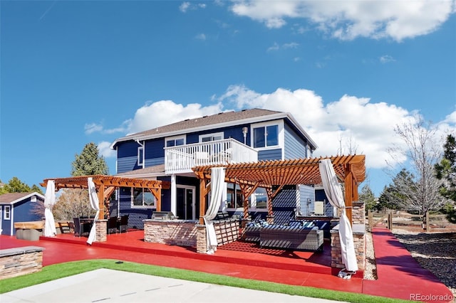 rear view of house featuring a pergola, an outdoor living space, a patio, and a deck