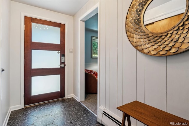 foyer entrance featuring baseboards