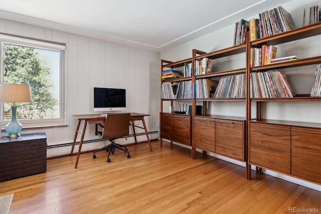 home office featuring light wood-style flooring and a baseboard radiator