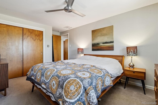 carpeted bedroom with a closet and a ceiling fan