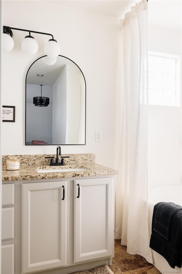 bathroom with vanity and shower / bathtub combination with curtain