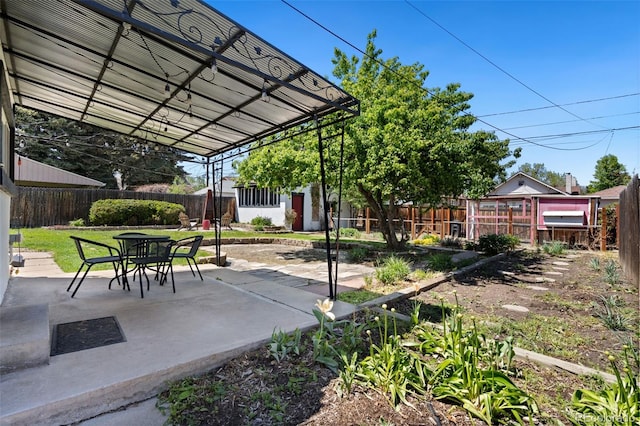 3147 W 39th Ave, Denver, CO 80211 - view of patio featuring a fenced backyard and an outdoor structure