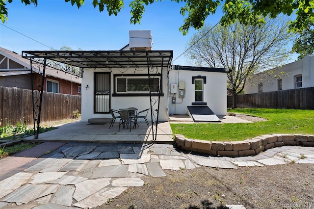 3147 W 39th Ave, Denver, CO 80211 - back of house with stucco siding, a patio, and a chimney