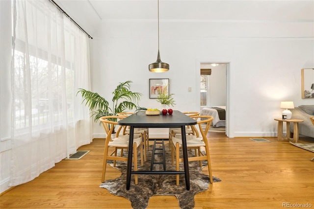 3147 W 39th Ave, Denver, CO 80211 - dining room featuring healthy amount of natural light, light wood-style floors, and baseboards