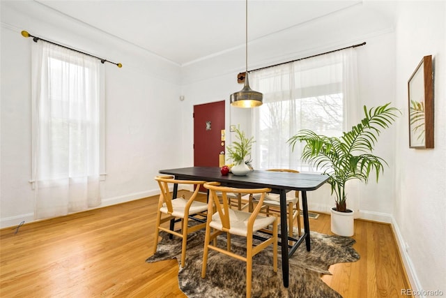 3147 W 39th Ave, Denver, CO 80211 - dining room with light wood-style floors and baseboards