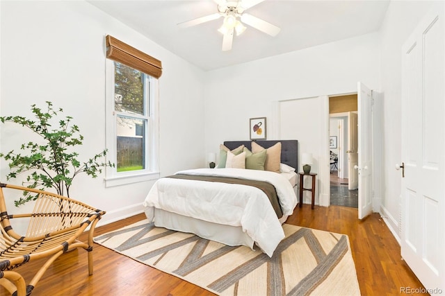3147 W 39th Ave, Denver, CO 80211 - bedroom with wood finished floors, baseboards, and ceiling fan