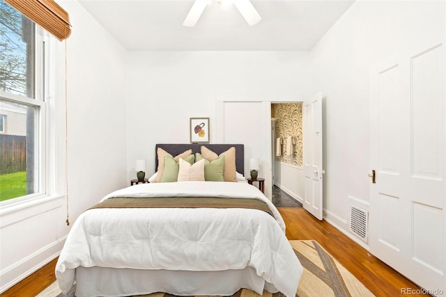 3147 W 39th Ave, Denver, CO 80211 - bedroom featuring wood finished floors, ceiling fan, and baseboards
