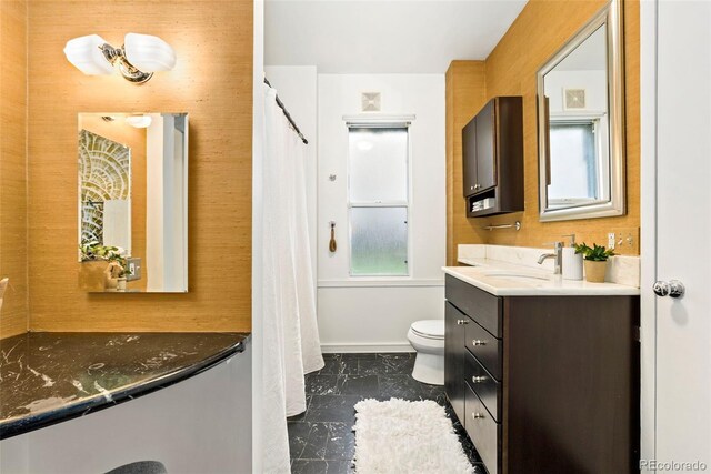 3147 W 39th Ave, Denver, CO 80211 - full bath featuring marble finish floors, toilet, vanity, and baseboards