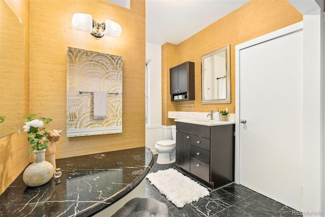 3147 W 39th Ave, Denver, CO 80211 - bathroom with vanity, marble finish floors, and toilet