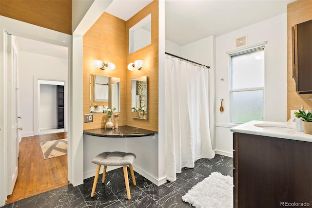 3147 W 39th Ave, Denver, CO 80211 - full bathroom with marble look tiles, vanity, baseboards, a shower with shower curtain, and a towering ceiling