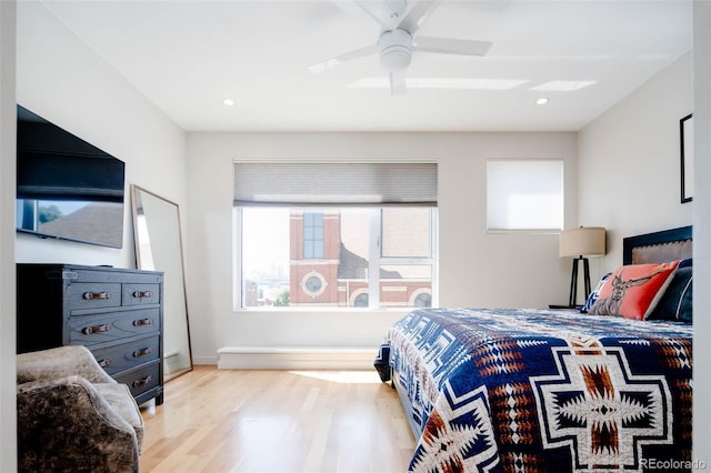 bedroom featuring ceiling fan and light wood-type flooring