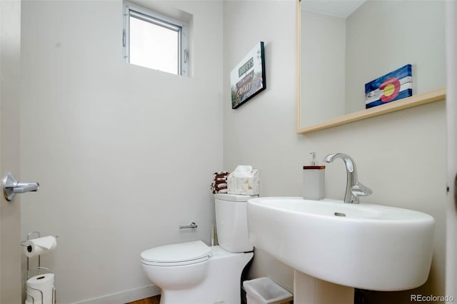 bathroom featuring toilet and sink