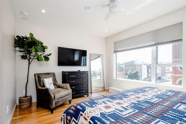 bedroom featuring hardwood / wood-style floors and ceiling fan