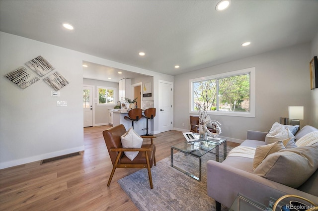 3216 Elizabeth, Denver, CO 80205 - living room with light wood-style flooring, recessed lighting, and baseboards