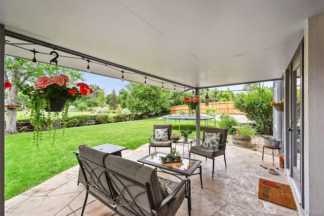 8413 E Jamison Cir, Englewood, CO 80112 - view of patio featuring a trampoline and an outdoor living space