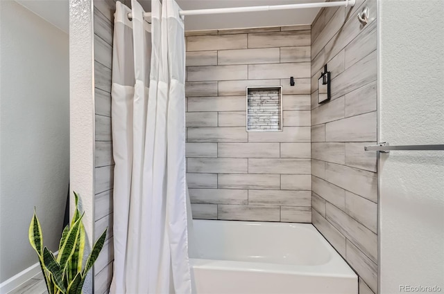 bathroom featuring shower / bath combination with curtain