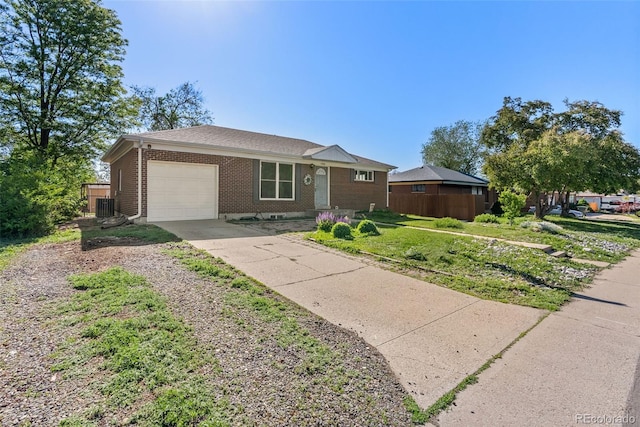 11320 Irma Dr, Northglenn, CO 80233 - ranch-style house featuring a garage, cooling unit, concrete driveway, and brick siding