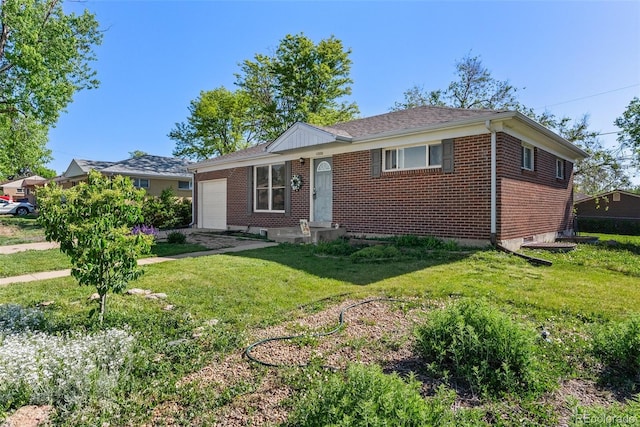 11320 Irma Dr, Northglenn, CO 80233 - view of front facade with a garage and brick siding