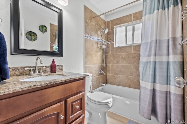 11320 Irma Dr, Northglenn, CO 80233 - bathroom featuring toilet, shower / bath combo with shower curtain, vanity, and wood finished floors