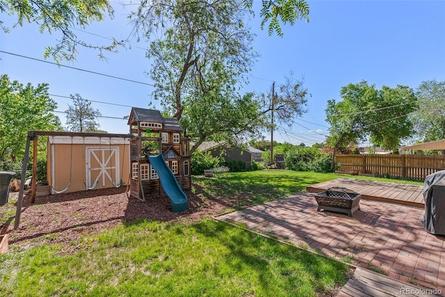 11320 Irma Dr, Northglenn, CO 80233 - view of yard with a fire pit, a playground, and a patio