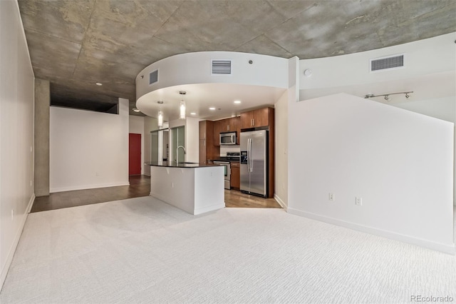 unfurnished living room featuring sink and light colored carpet