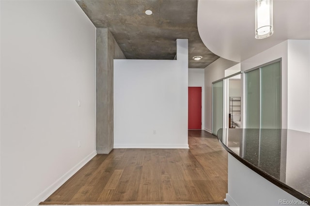 hallway featuring wood-type flooring