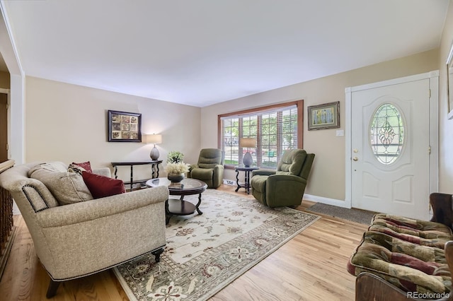 living room with wood finished floors and baseboards