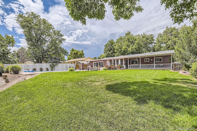 view of yard with a fenced backyard and a patio area