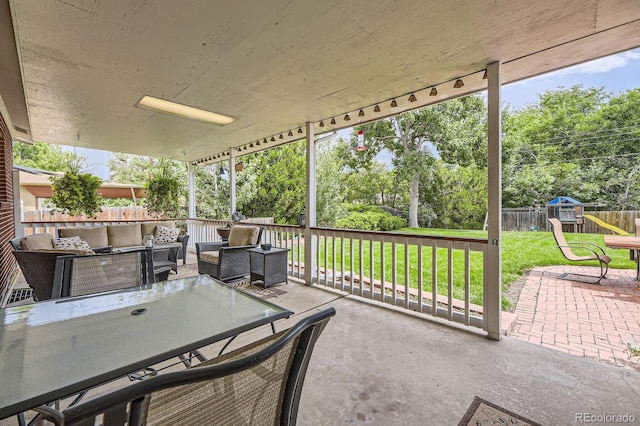 view of patio featuring an outdoor living space and a fenced backyard