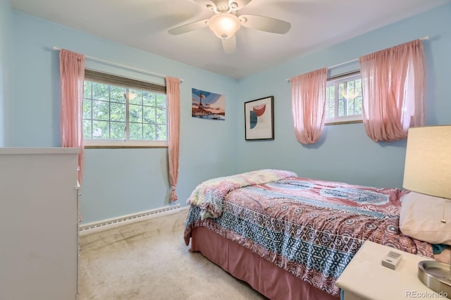 bedroom featuring baseboards, baseboard heating, ceiling fan, and light colored carpet