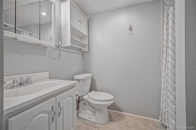 bathroom featuring toilet, baseboards, tile patterned flooring, and vanity