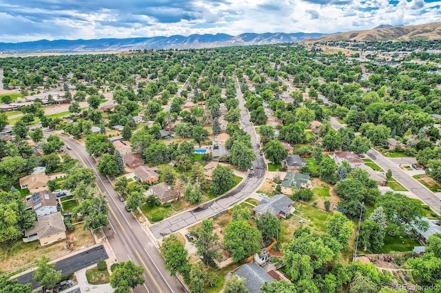 birds eye view of property with a mountain view and a residential view