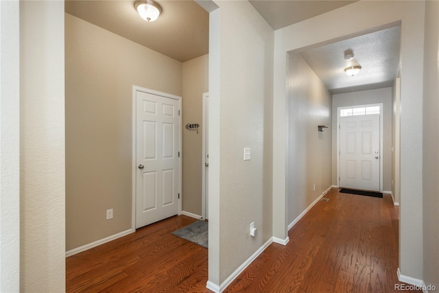 6434 N Ensenada Ct, Aurora, CO 80019 - hall with baseboards and wood finished floors