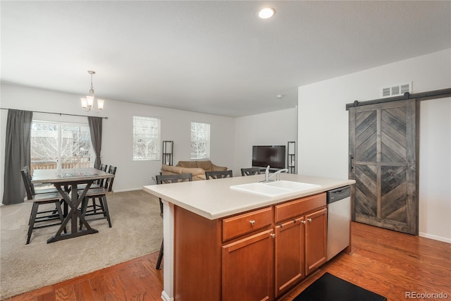 6434 N Ensenada Ct, Aurora, CO 80019 - kitchen featuring a sink, a wealth of natural light, stainless steel dishwasher, and visible vents