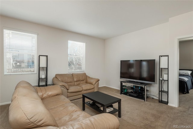 6434 N Ensenada Ct, Aurora, CO 80019 - carpeted living room with a healthy amount of sunlight and baseboards