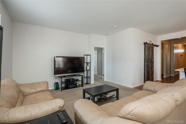6434 N Ensenada Ct, Aurora, CO 80019 - living area with baseboards, a barn door, and carpet
