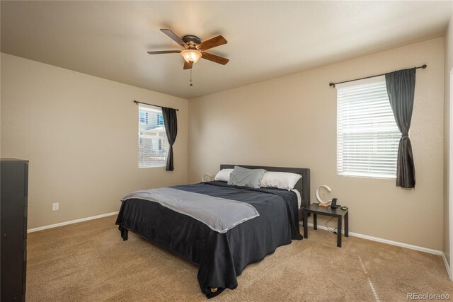 6434 N Ensenada Ct, Aurora, CO 80019 - bedroom featuring baseboards, ceiling fan, and light carpet