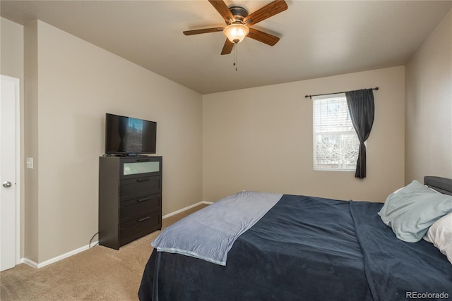 6434 N Ensenada Ct, Aurora, CO 80019 - bedroom featuring light colored carpet, a ceiling fan, and baseboards