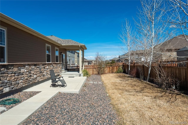 6434 N Ensenada Ct, Aurora, CO 80019 - view of yard with a patio and a fenced backyard