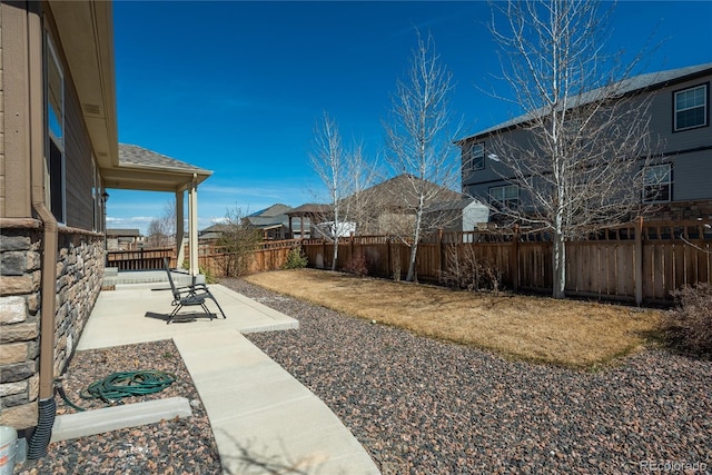 6434 N Ensenada Ct, Aurora, CO 80019 - view of yard with a patio and a fenced backyard