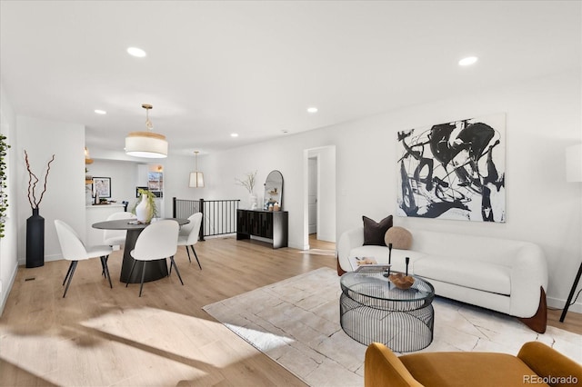 living room with light hardwood / wood-style flooring