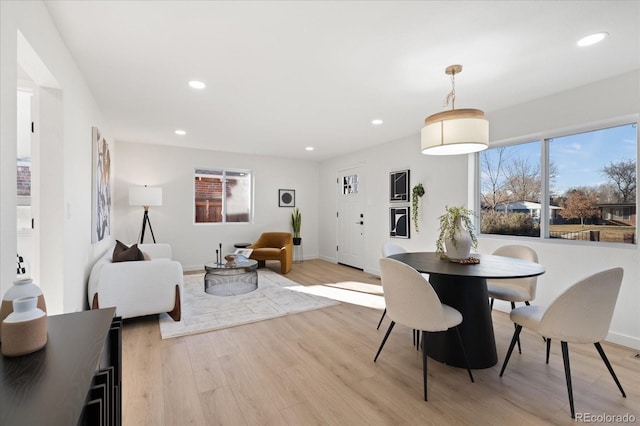 dining area featuring light wood-type flooring