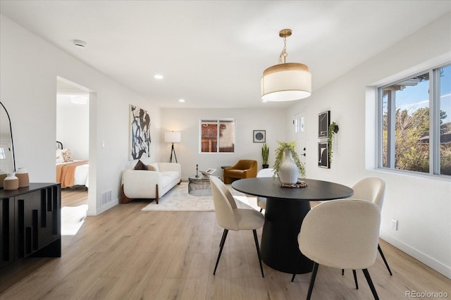 dining area with light hardwood / wood-style flooring