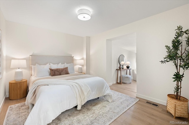 bedroom with light hardwood / wood-style flooring