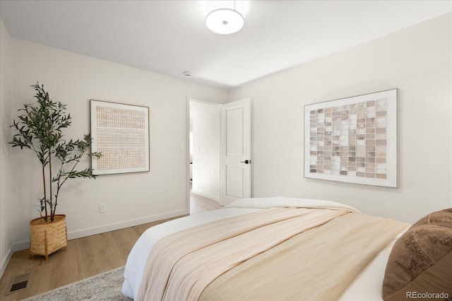 bedroom with light wood-type flooring