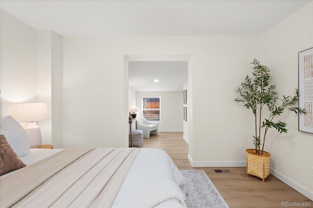 bedroom featuring light hardwood / wood-style flooring