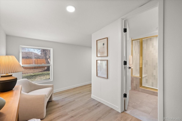 living area with light hardwood / wood-style flooring