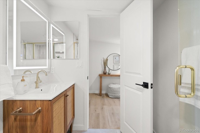 bathroom featuring hardwood / wood-style floors and vanity